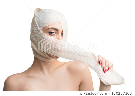 Girl her head and neck bandaged at plastic surgeon Girl her head and neck bandaged at plastic surgeon 120267166