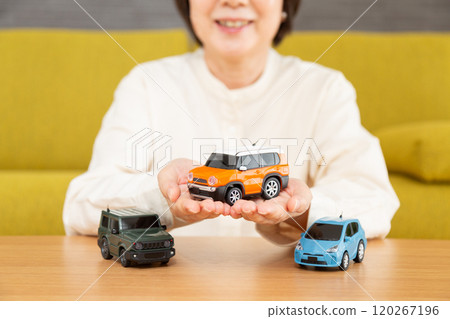 Middle-aged to senior women with cars 120267196