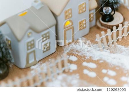 Small house and fence surrounded by snow - winter fantasy with warm lights Small house and fence surrounded by snow - winter fantasy with warm lights 120268003