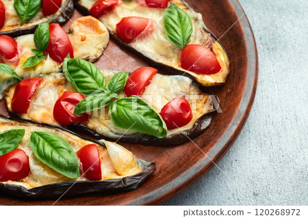 Italian mini pizza . Aubergine (eggplant ) with mozzarella cheese and basil . On rustic background 120268972