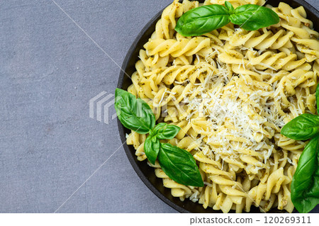 Pasta with basil sauce pesto . Italian food photography . Top view Pasta with basil sauce pesto . Italian food photography . Top view 120269311