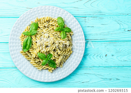 Pasta with basil sauce pesto . Italian food photography . Top view Pasta with basil sauce pesto . Italian food photography . Top view 120269315