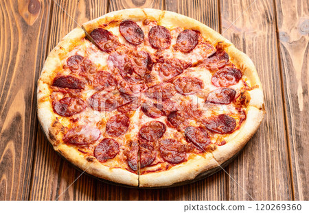 Pizza pepperoni fast food . Top view on rustic background 120269360