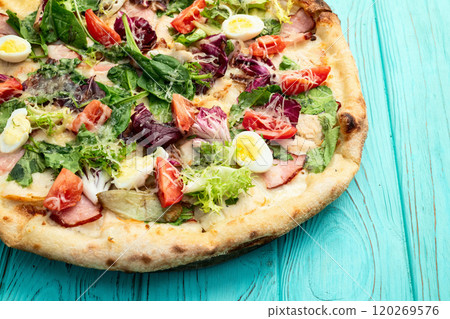 Italian pizza caesar with eggs salad chicken tomatoes and mozzarella photography. top view 120269576