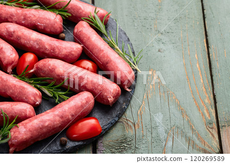 Raw beef sausages with rosemary and tomatoes photography . Top view Raw beef sausages with rosemary and tomatoes photography . Top view 120269589