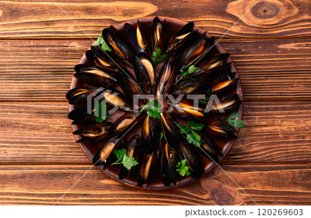 Mussels with parsley on a plate photography Mussels with parsley on a plate photography 120269603
