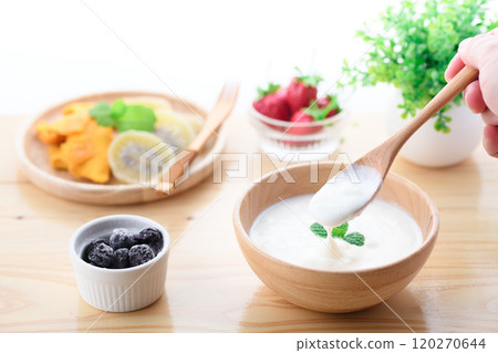 Yogurt served in a wooden bowl (plain yogurt) Yogurt served in a wooden bowl (plain yogurt) 120270644