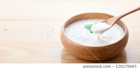 Yogurt served in a wooden bowl (plain yogurt) Yogurt served in a wooden bowl (plain yogurt) 120270665