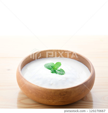 Yogurt served in a wooden bowl (plain yogurt) Yogurt served in a wooden bowl (plain yogurt) 120270667