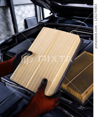 Replacing air filter in automotive engine 120270903
