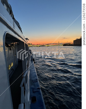 Evening Boat Ride Along Calm Waters at Sunset 120273338