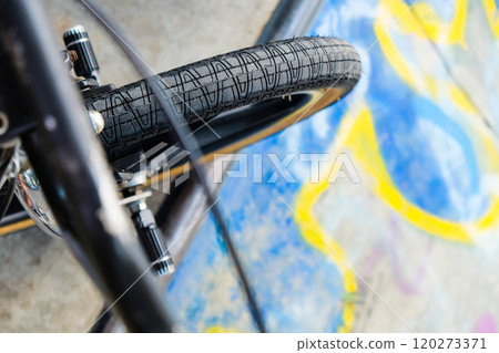 Close up of bmx bike on a ramp in a skatepark 120273371