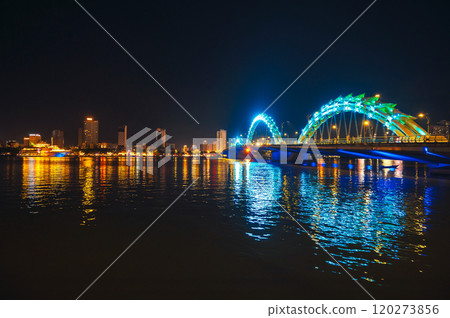 Dragon Bridge over Han River is famous landmark in city of Da Nang in Vietnam at night 120273856