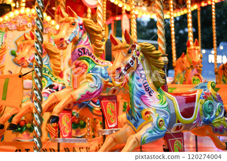 Vivid vintage horse carousel in amusement park Vivid vintage horse carousel in amusement park 120274004