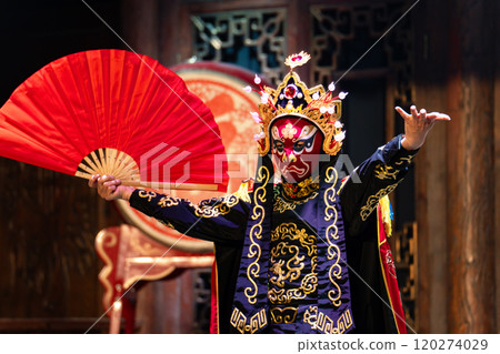 Chinese actor performs a public traditional changing face performance onstage in Chengdu, China 120274029