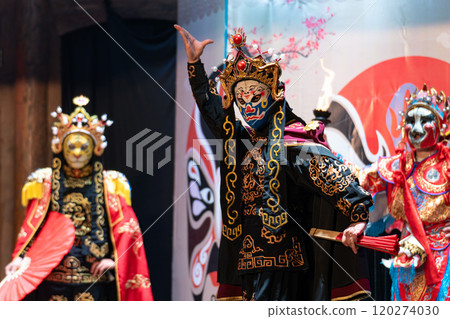 Chinese actor performs a public traditional changing face performance onstage in Chengdu, China 120274030
