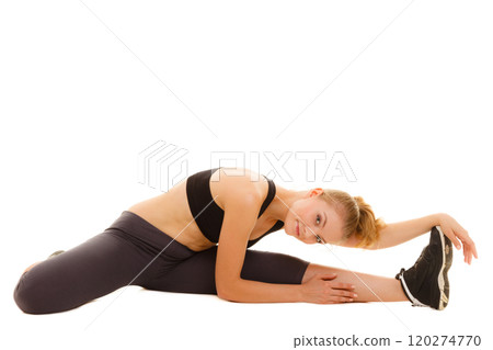 woman in sportswear doing stretching exercise 120274770