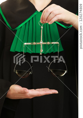 woman barrister holding scales. woman barrister holding scales. 120274809
