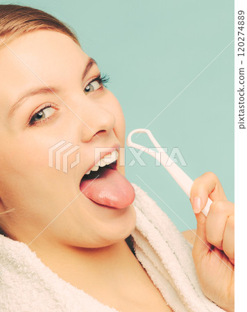 Girl with tongue cleaner. Girl with tongue cleaner. 120274889
