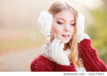 Pretty gorgeous woman in earmuffs. Pretty gorgeous woman in earmuffs. 120274923