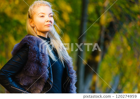 Fashion woman walking in autumn park Fashion woman walking in autumn park 120274959