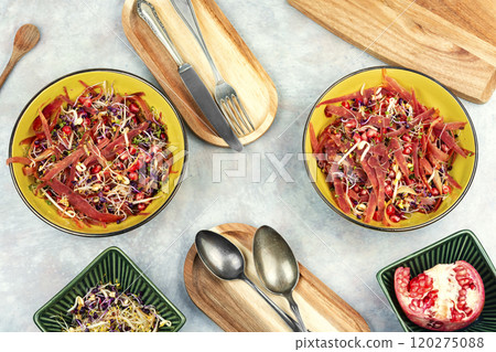 Sprouts and pomegranate salad. 120275088