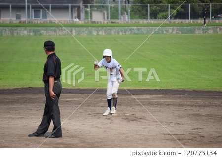 A boy playing baseball A boy playing baseball 120275134