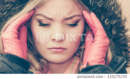 Woman suffering from headache pain. Cold. 120275230