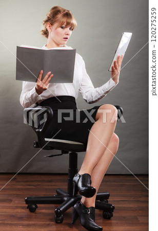 Woman learning with ebook and book. Education. Woman learning with ebook and book. Education. 120275259