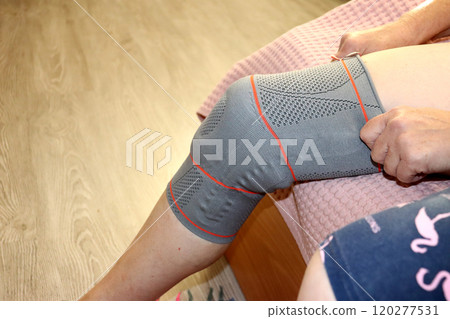 Female leg with orthosis - top and side view 120277531