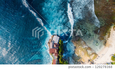 Landscape with rocks on coastline and blue ocean with waves in Lembongan island, Bali. Aerial view Landscape with rocks on coastline and blue ocean with waves in Lembongan island, Bali. Aerial view 120278168