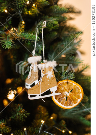 Christmas tree with a pair of skates toy and orange slice Christmas tree with a pair of skates toy and orange slice 120278193