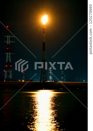 Flare stack reflecting on the water surface Flare stack reflecting on the water surface 120278660