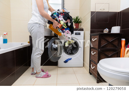 Laundry Day A Simple Yet Significant Moment of Routine in a Contemporary Bathroom Space 120279058