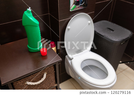 A Clean and WellOrganized Bathroom Featuring a Toilet and Essential Supplies for Comfort 120279116