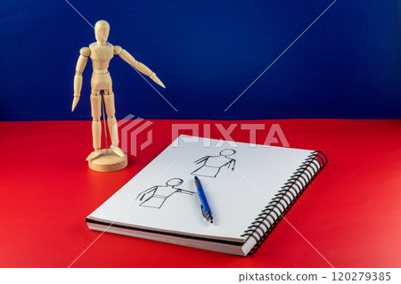 Artists Wooden Model with Sketch Pad and Pencil on a Red Base and Blue Background 120279385