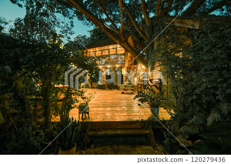 wooden cottage house at night wooden cottage house at night 120279436