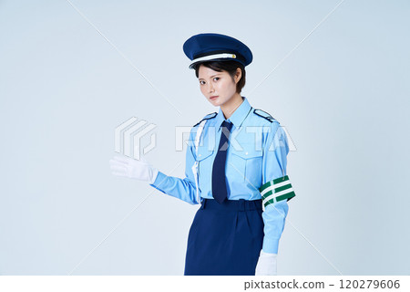 A woman wearing a security guard uniform posing for guidance 120279606