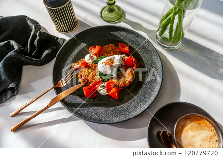 Light breakfast in a restaurant with coffee, poached egg and salmon gravlax 120279720