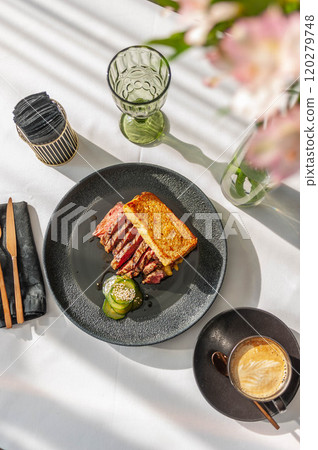 Hearty breakfast with beef steak, toast and crushed cucumbers 120279748