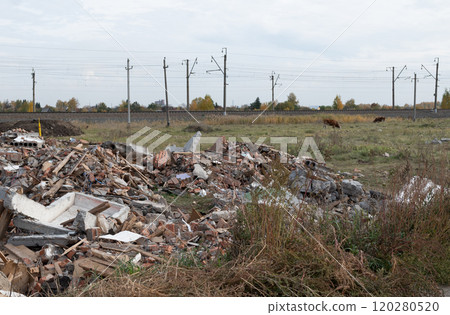 Construction waste. A pile of red broken bricks, concrete debris and rubble. Demolition rubble 120280520