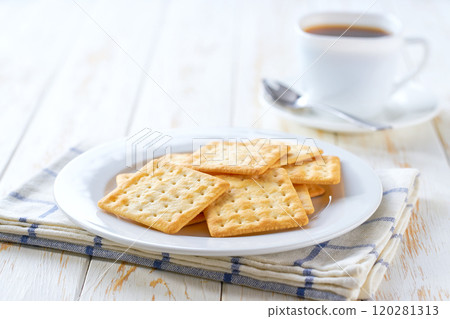 Wheat biscuits and coffee on a white table, selective focus. 120281313