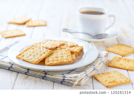 Wheat biscuits and coffee on a white table, selective focus. 120281314