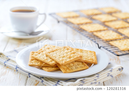 Wheat biscuits and coffee on a white table, selective focus. 120281316
