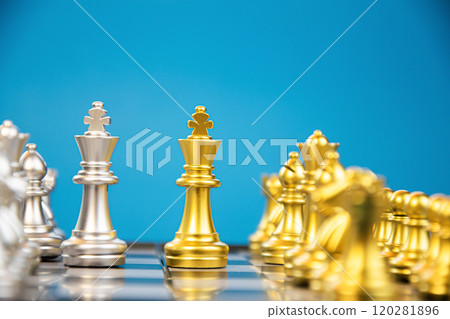 The striking image of a golden king chess piece in front of silver chess pieces, symbolizing the strategy and competition in chess. The striking image of a golden king chess piece in front of silver chess pieces, symbolizing the strategy and competition in chess. 120281896
