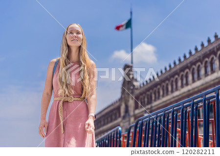 Female tourist in the central square of Mexico City, Zocalo. Cultural exploration, travel, and historic architecture concept Female tourist in the central square of Mexico City, Zocalo. Cultural exploration, travel, and historic architecture concept 120282211