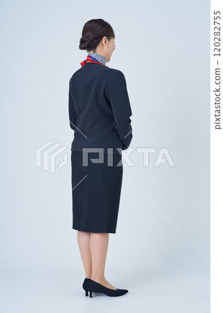 A woman in a suit with a scarf around her neck A woman in a suit with a scarf around her neck 120282755