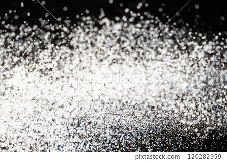 Abstract black and white background of pouring flour, space for text 120282959