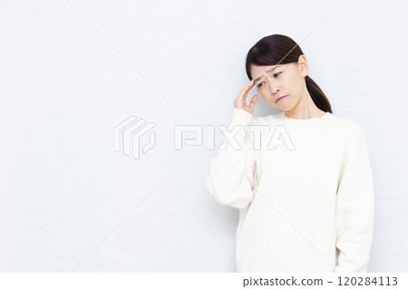 A woman with a headache A woman with a headache 120284113