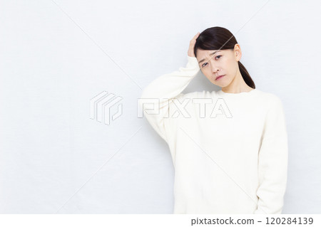 A woman with a headache A woman with a headache 120284139